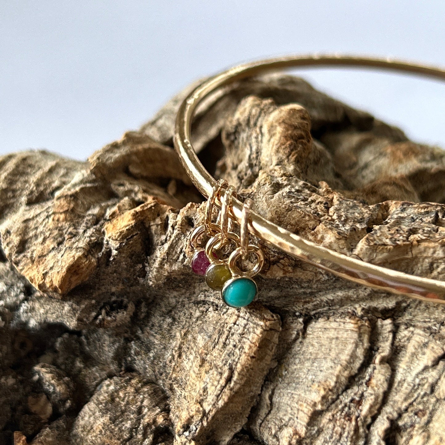 Gold Bangle With Gemstone Charms