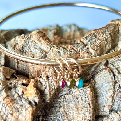 Gold Bangle With Gemstone Charms